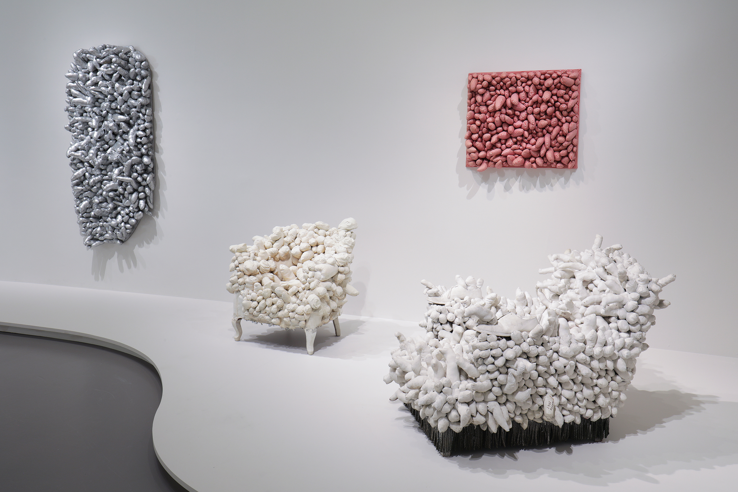 Left to right: Ennui, 1976; Accumulation, 1962-64; Red Stripes, 1965; Arm Chair, 1963.