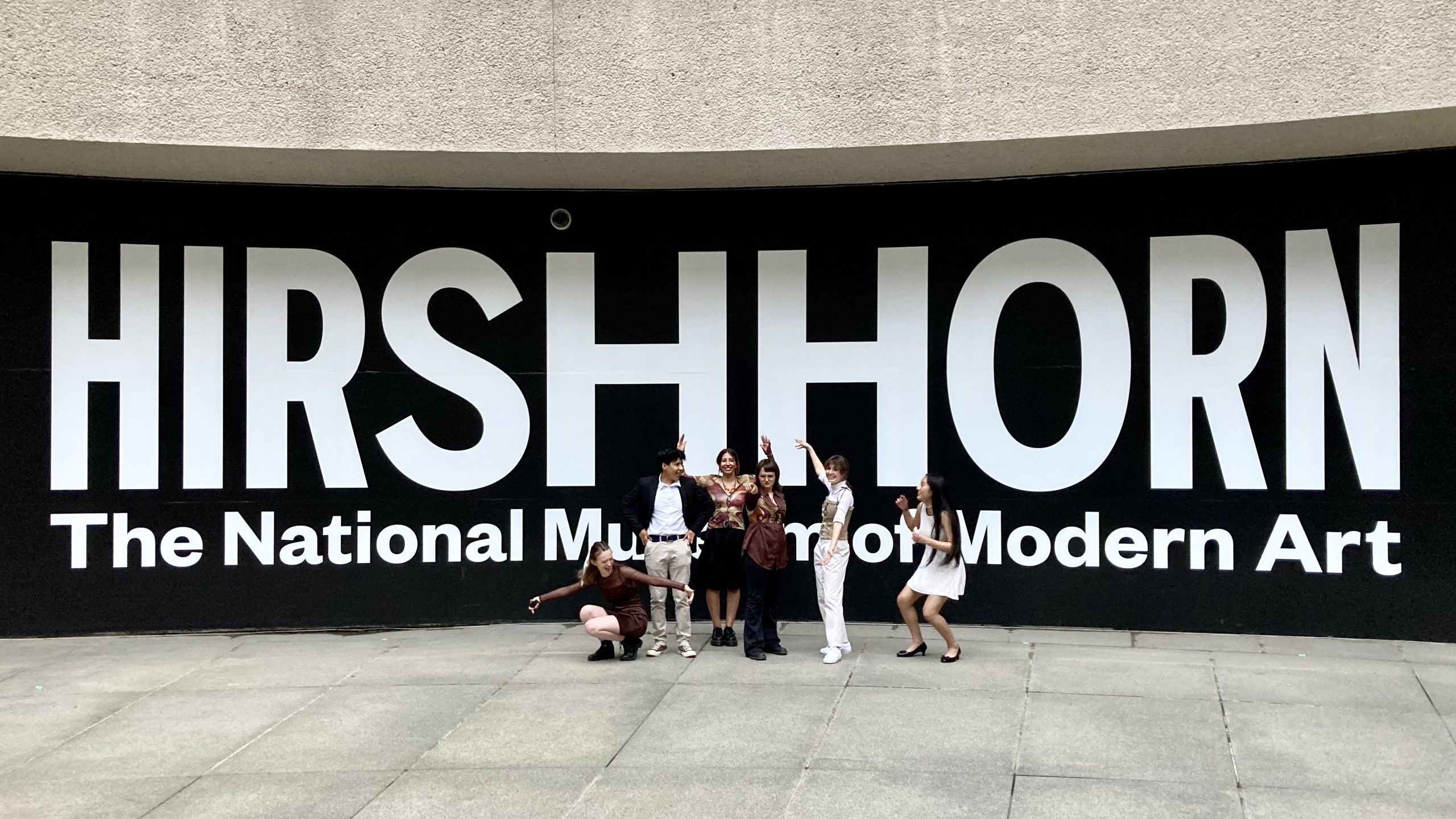 Teens standing in front of wall that reads Hirshhorn The National Museum of Modern Art