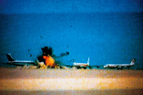 Three hijacked jets on desert airstrip, Amman, Jordan, September 12, 1970. Still from Johan Grimonprez’s Dial H-I-S-T-O-R-Y, 1997. Courtesy of zap-o-matik & Sean Kelly, New York