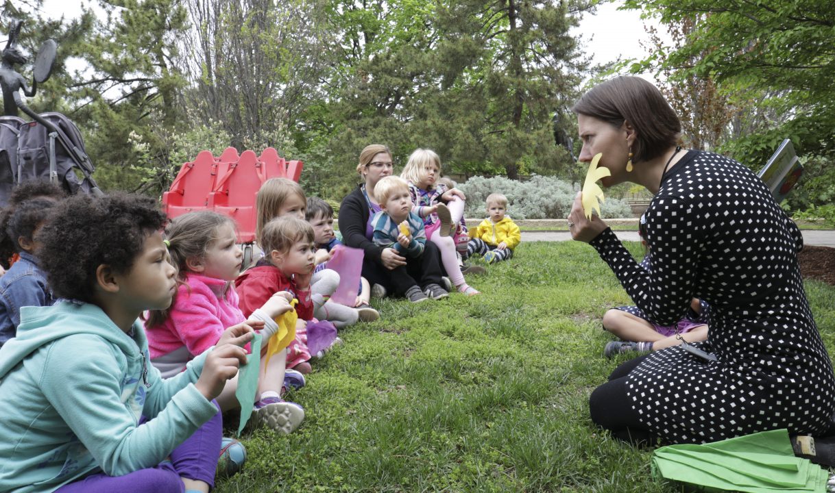Children in sculpture garden participating in STORYTIME
