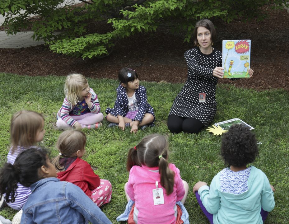 Children in sculpture garden participating in STORYTIME