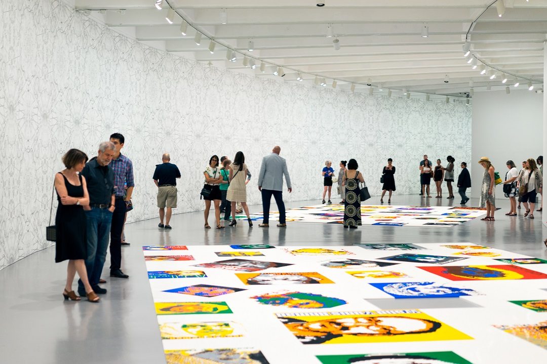 Visitors in gallery Ai Weiwei Trace at Hirshhorn