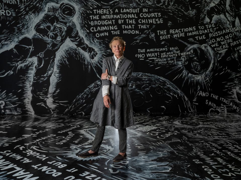 The artist Laurie Anderson stands in the middle of the Four Talks Gallery in The Weather, her current exhibition at the Hirshhorn.