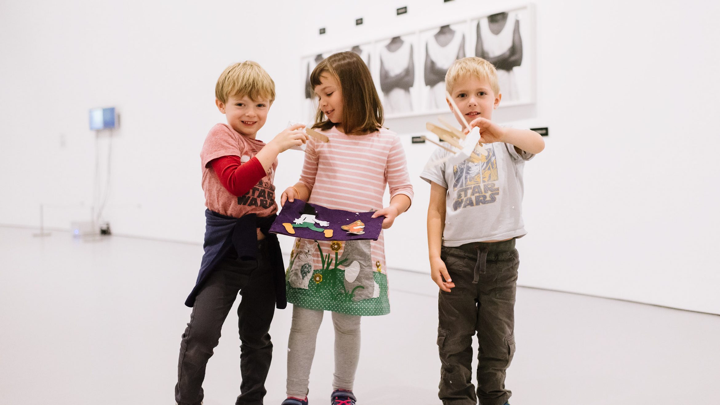 Children in gallery with craft project