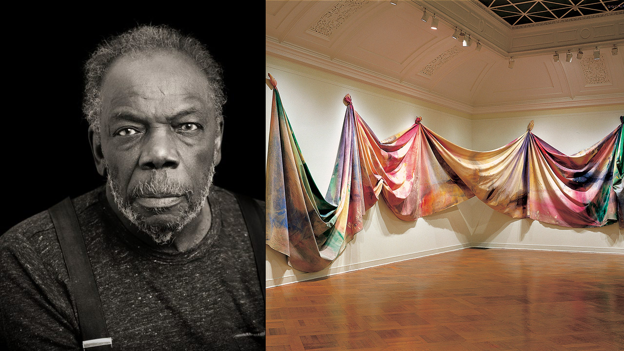 Left black and white portrait of artist Sam Gilliam, right colorful painted fabric draped on gallery wall