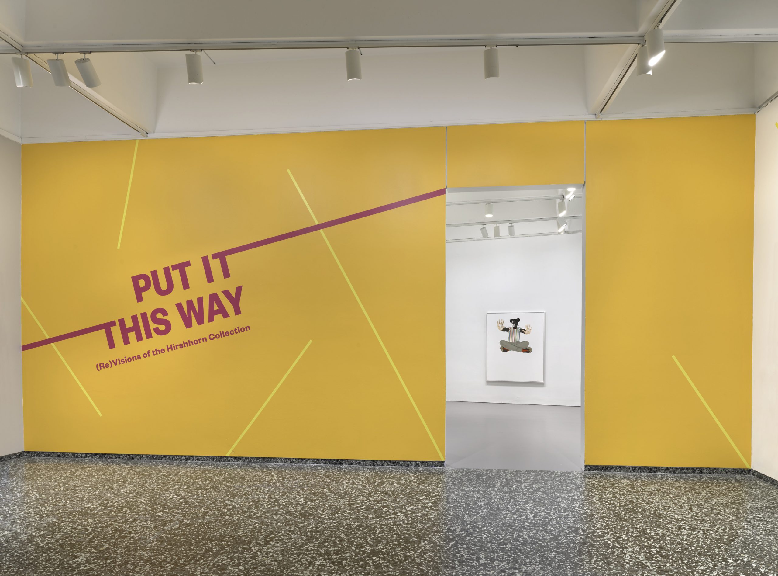 A bright yellow wall reads "PUT IT THIS WAY: (Re)Visions of the Hirshhorn Collection"