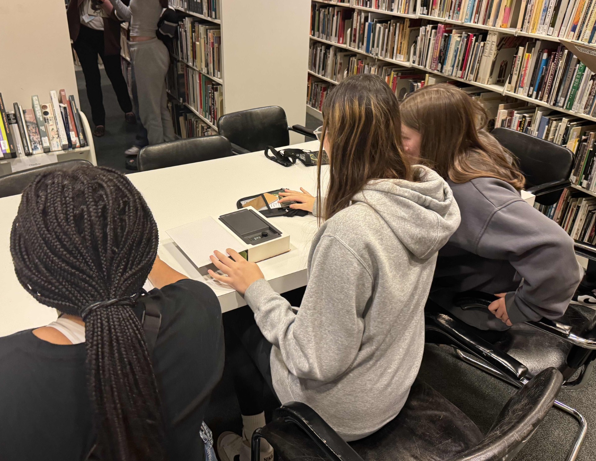 Teens at a table participating in an activity